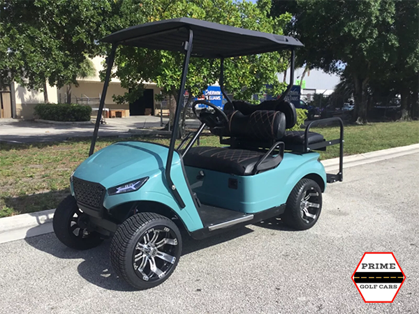 Blue EZGO 4 Passenger Golf Cart on the top of the world golf cart rental, golf cart rentals