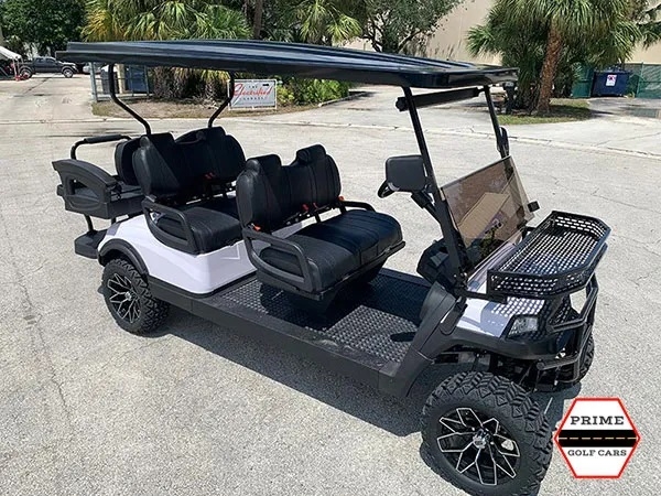 White Aluma 6 Passenger Lifted Golf Cart affordable golf cart rental, golf cart rent on top of the world