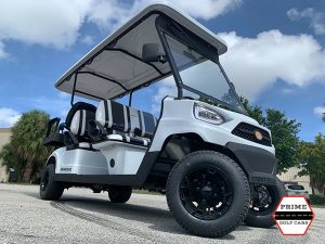 White Bintelli Nemesis 6 Passenger Golf Cart on top of the world golf cart rental, golf cart rentals