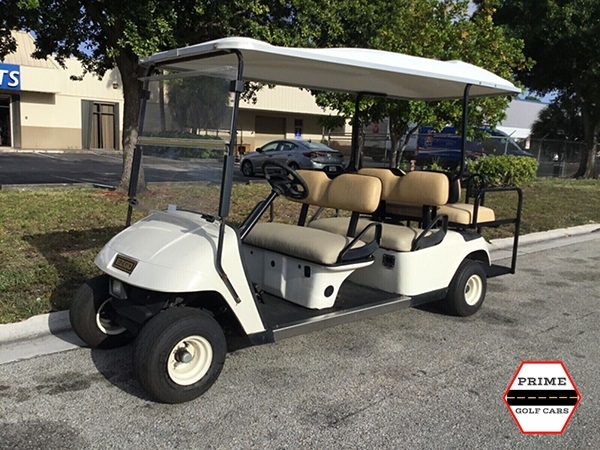White EZGO 6 Passenger Golf Cart affordable golf cart rental, golf cart rent on top of the world
