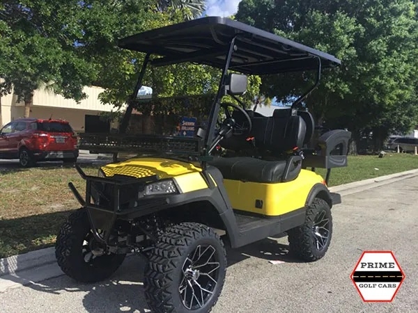 Yellow Aluma 4 Passenger Lifted Golf Cart affordable golf cart rental, golf cart rent on top of the world